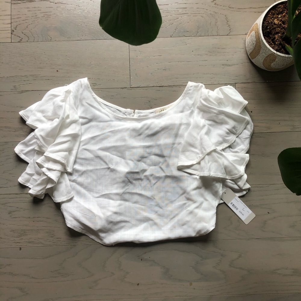 Cropped white blouse with open back